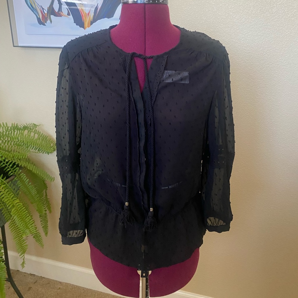 Sheer peplum black top